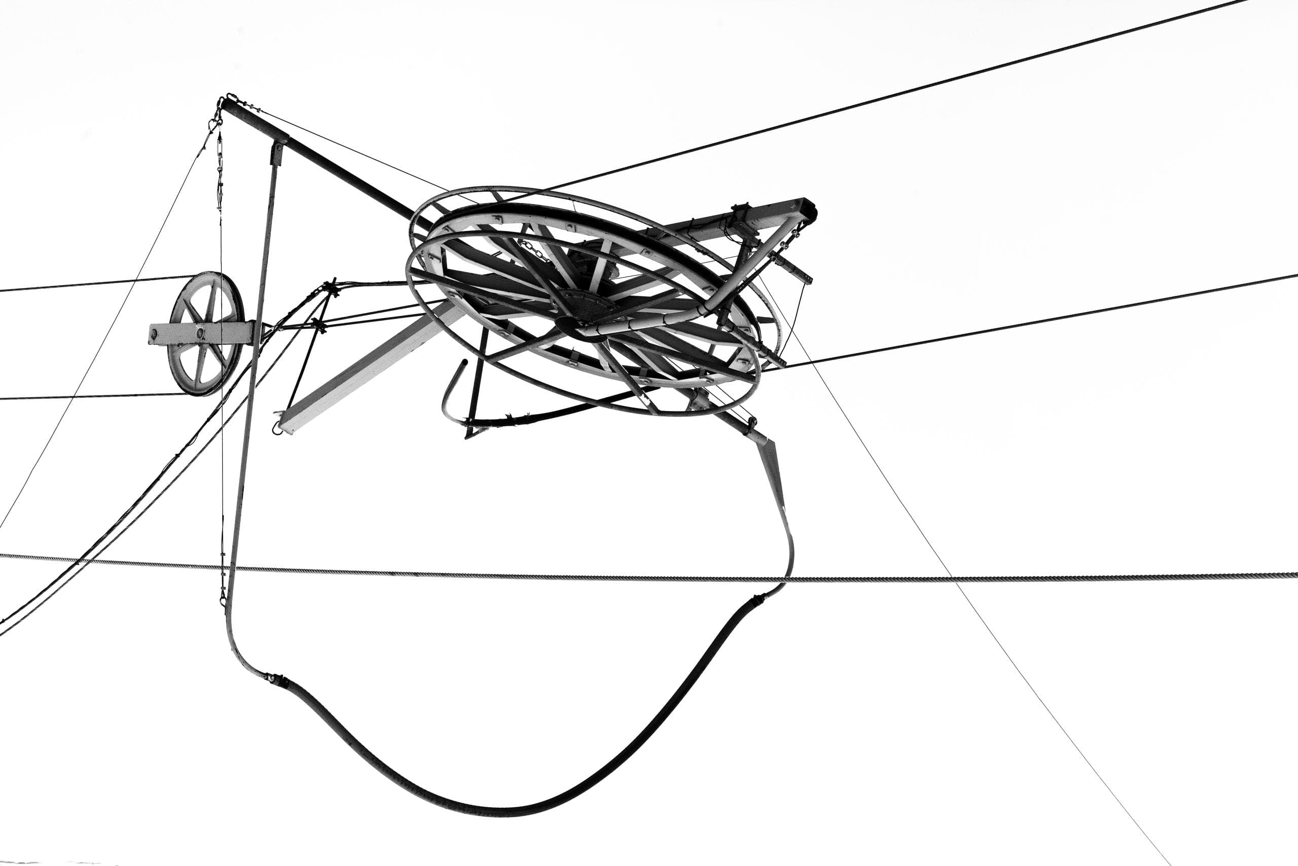 Pulley and cables of a ski lift, black and white