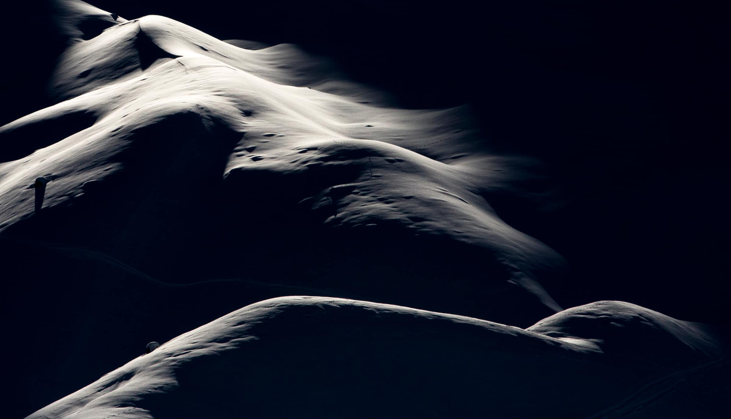Snow-covered slope in Courchevel, black and white